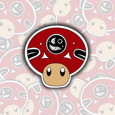 This sticker features a mushroom. The mushroom has cutesy eyes and a red mushroom top. Inside the center of the mushroom top is a black circle.